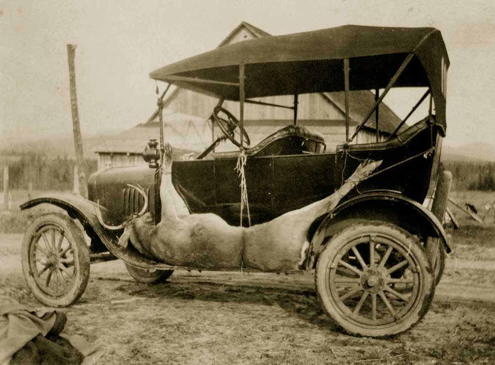 A proud sportsman leaves Indian Lake village.